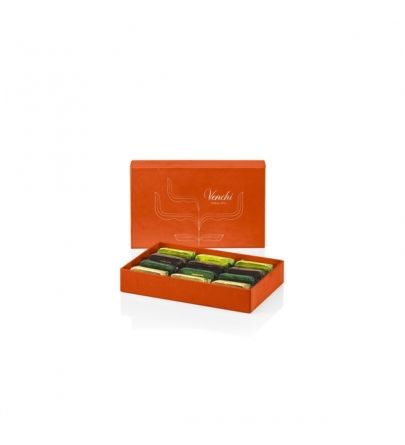 Assorted Gianduiotto chocolates in a golden gift box